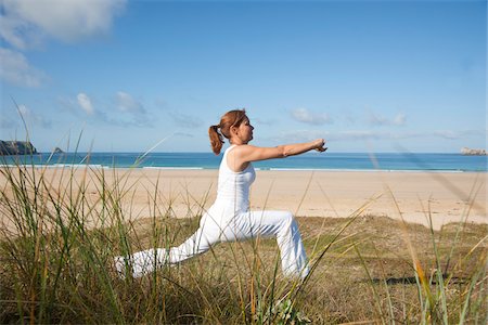 person lunge - Woman Practicing Yoga on Beach, Camaret-sur-Mer, Finistere, Bretagne, France Stock Photo - Premium Royalty-Free, Code: 600-05389143