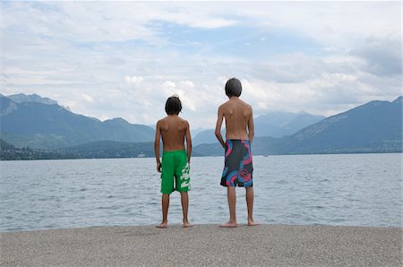 sight seeing with family - Back View of Boys Standing on Shore of Lake, Annecy, Alps, France Stock Photo - Premium Royalty-Free, Code: 600-05524682