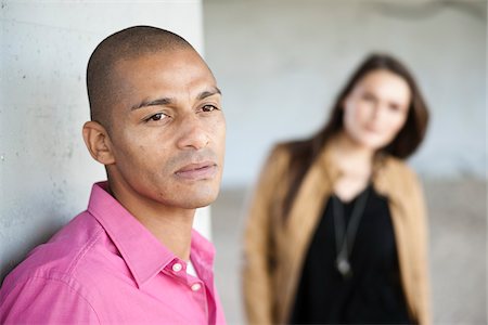 Portrait of Man with Woman in Background Stock Photo - Premium Royalty-Free, Code: 600-05609745