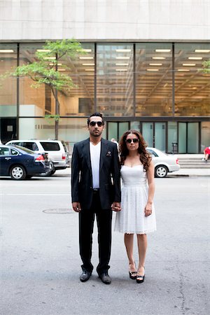 ethnic couple lifestyle not kids full length not eye contact - Portrait of Couple, Toronto, Ontario, Canada Stock Photo - Premium Royalty-Free, Code: 600-05786089