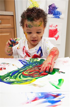 paint children - Little Boy Finger Painting Stock Photo - Premium Royalty-Free, Code: 600-05786121