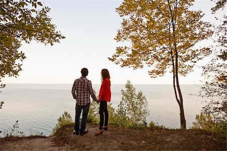 shirt partner - Backview of Young Couple Standing at Edge of Cliff Looking out at View, Ontario, Canada Stock Photo - Premium Royalty-Free, Code: 600-05786160