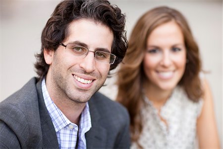 smiling young man - Close-up Portrait of Young Couple Stock Photo - Premium Royalty-Free, Code: 600-05786174