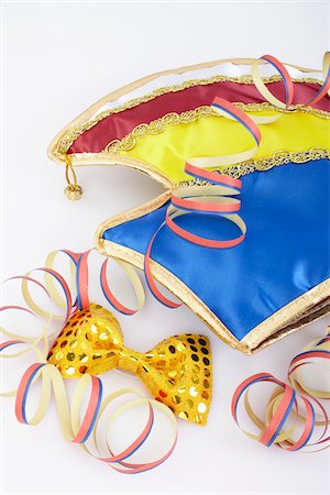 party streamers on white background - Carnival Hat and Bow Tie Stock Photo - Premium Royalty-Free, Code: 600-05854169