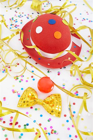 red confetti - Bow Tie, Clown Nose and Hat Stock Photo - Premium Royalty-Free, Code: 600-05854172