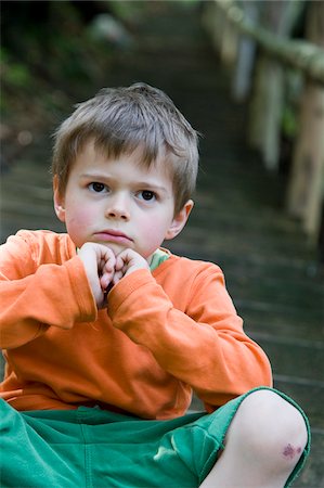 portrait of a young boy - Portrait of Boy on Steps Stock Photo - Premium Royalty-Free, Code: 600-05969983