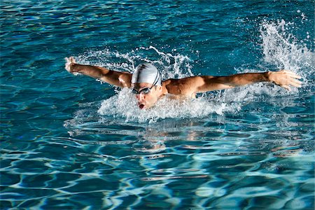 swimmers in pool from above - Swimmer, Jupiter, Palm Beach County, Florida, USA Stock Photo - Premium Royalty-Free, Code: 600-05973055