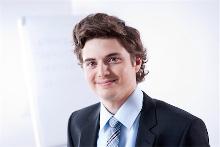 Close-up Portrait of Young Businessman Stock Photo - Premium Royalty-Free, Code: 600-05973092