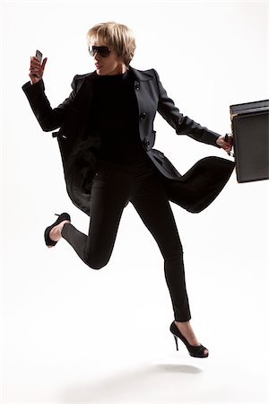 Business Woman Running Stock Photo - Premium Royalty-Free, Code: 600-05973927