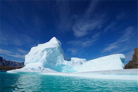 Iceberg and Mountains, Bjorn Oer, Ittoqqortoormiit, Sermersooq, Greenland Stock Photo - Premium Royalty-Free, Code: 600-06009039