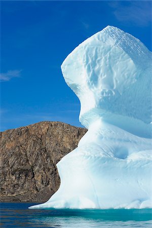 Iceberg and Mountains, Bjorn Oer, Ittoqqortoormiit, Sermersooq, Greenland Stock Photo - Premium Royalty-Free, Code: 600-06009032