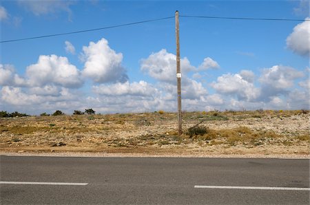 power pylon blue sky - Utility Pole on Side of Country Road, Murviel-les-Montpellier, Herault, France Foto de stock - Sin royalties Premium, Código: 600-06025235