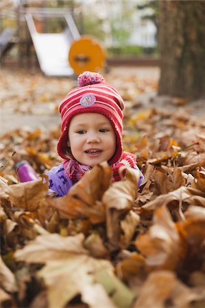 Girl in Fall Leaves, Germany Stock Photo - Premium Royalty-Free, Code: 600-06144985