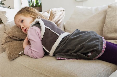 Girl Lying on Sofa Stock Photo - Premium Royalty-Free, Code: 600-06208600