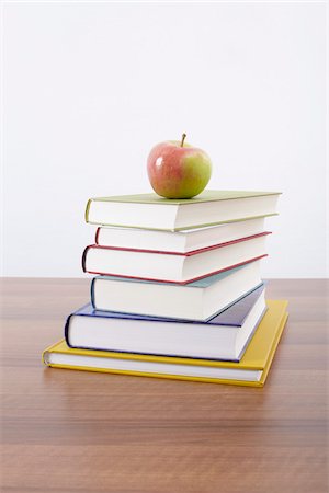 stack of text books - Books and Apple Stock Photo - Premium Royalty-Free, Code: 600-06302228