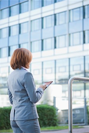 Businesswoman using Tablet PC, Niederrad, Frankfurt, Germany Stock Photo - Premium Royalty-Free, Code: 600-06355233