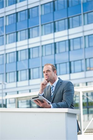 simsearch:700-05452213,k - Businessman using Tablet PC, Niederrad, Frankfurt, Germany Stock Photo - Premium Royalty-Free, Code: 600-06355242