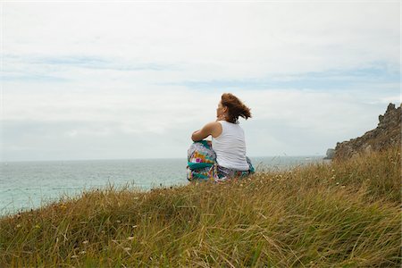 simsearch:600-06407695,k - Woman Sitting and Looking into the Distance at the Beach, Camaret-sur-Mer, Crozon Peninsula, Finistere, Brittany, France Stock Photo - Premium Royalty-Free, Code: 600-06382806