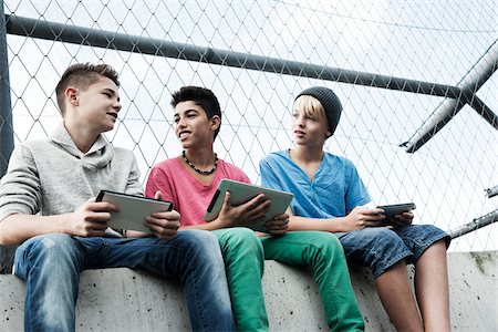 summer clothes - Boys with Tablets and Video Games in Playground, Mannheim, Baden-Wurttemberg, Germany Stock Photo - Premium Royalty-Free, Code: 600-06382853