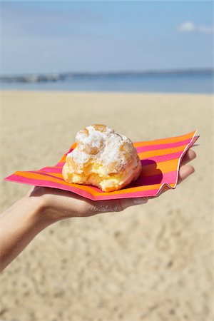 eating on the beach - Woman Holding Cake, Andernos-les-Bains, Arcachon, Gironde, Aquitaine, France Stock Photo - Premium Royalty-Free, Code: 600-06397432