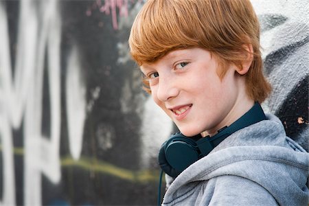 Close-up Portrait of Boy wearing Headphones, Mannheim, Baden-Wurttemberg, Germany Stock Photo - Premium Royalty-Free, Code: 600-06397441