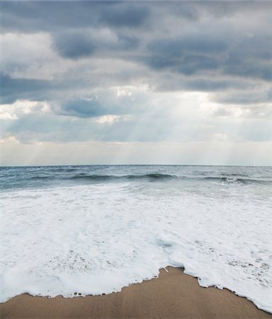Waves at Beach with Sunrays through Clouds, Point Pleasant, New Jersey, USA Stock Photo - Premium Royalty-Free, Code: 600-06438866