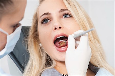 dentelle - Young Woman getting Check-up at Dentist's Office, Germany Stock Photo - Premium Royalty-Free, Code: 600-06438880
