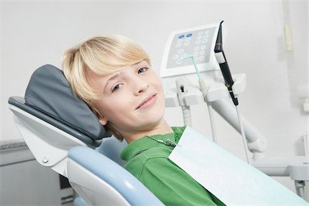 portrait of a young boy - Portrait of Boy in Dentist's Chair for Appointment, Germany Stock Photo - Premium Royalty-Free, Code: 600-06438906