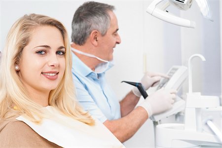 female latex gloves - Portrait of Young Woman and Dentist in Dentist's Office, Germany Stock Photo - Premium Royalty-Free, Code: 600-06438924