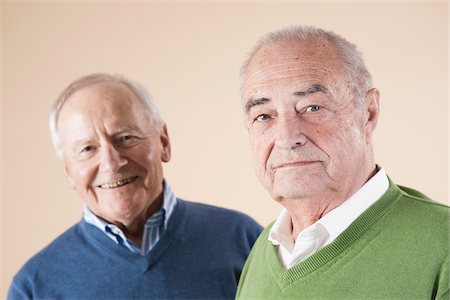 Portrait of Two Senior Men Looking at Camera, Studio Shot on Beige Background Stockbilder - Premium RF Lizenzfrei, Bildnummer: 600-06438986