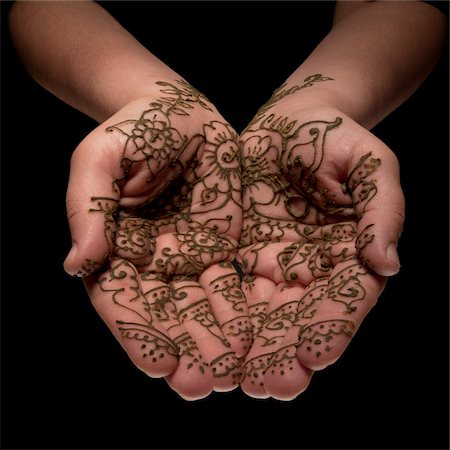 Close-up of Woman's Hands with Henna Designs, Studio Shot Stock Photo - Premium Royalty-Free, Code: 600-06452122