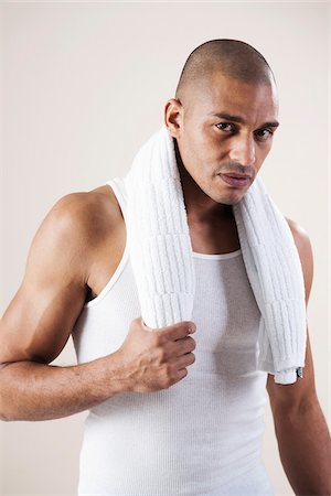 Man Wearing Work Out Clothes in Studio with White Background Stock Photo - Premium Royalty-Free, Code: 600-06485924