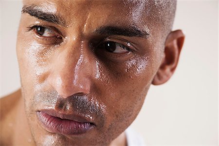 simsearch:600-06485944,k - Close-Up Man's Sweating Face in Studio with White Background Stock Photo - Premium Royalty-Free, Code: 600-06485945