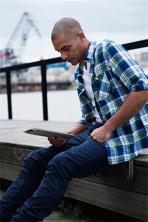Portrait of Man Using a Tablet Outdoors, Mannheim, Baden-Wurttemberg, Germany Stock Photo - Premium Royalty-Free, Code: 600-06485969