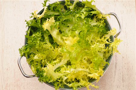 simsearch:600-06486072,k - Overhead View of Lettuce in Colander for Salad on Beige Background, Studio Shot Stock Photo - Premium Royalty-Free, Code: 600-06486078