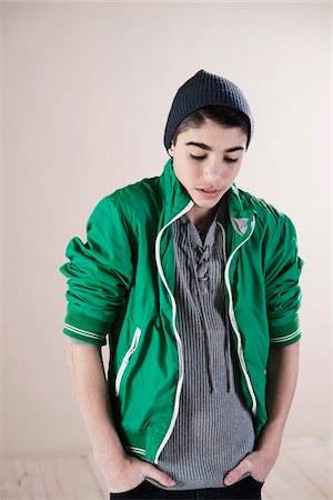 dark hair caucasian boys - Waist up Portrait of Boy with Hands in Pockets in Studio Photographie de stock - Premium Libres de Droits, Code: 600-06486397