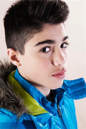 dark hair caucasian boys - Portrait of Boy in Winter Coat in Studio Photographie de stock - Premium Libres de Droits, Code: 600-06486425