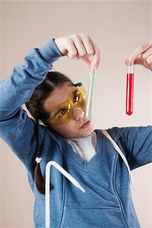 scrutiny - Portrait of Girl Holding Test Tubes, Mannheim, Baden-Wurttemberg, Germany Stock Photo - Premium Royalty-Free, Code: 600-06486455