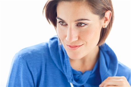 Head and Shoulders Portrait of Woman wearing Hoodie in Studio Stock Photo - Premium Royalty-Free, Code: 600-06531607