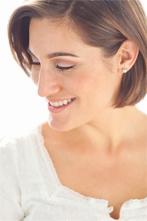 smile women face - Head and Shoulders Portrait of Young Woman in Studio Stock Photo - Premium Royalty-Free, Code: 600-06531617