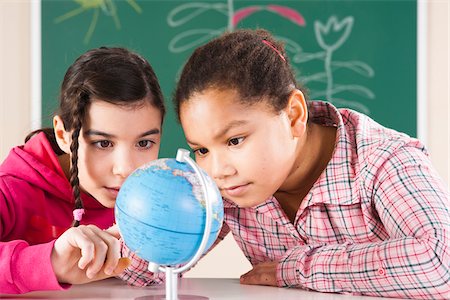 Portrait of Girls Looking at Globe in Classroom, Baden-Wurttemberg, Germany Stock Photo - Premium Royalty-Free, Code: 600-06548576