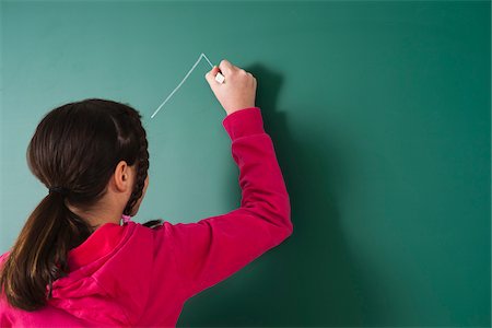 Girl Drawing on Blackboard in Classroom, Baden-Wurttemberg, Germany Stock Photo - Premium Royalty-Free, Code: 600-06548570