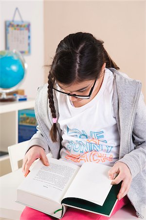 simsearch:600-07192152,k - Girl Reading Book in Classroom, Mannheim, Baden-Wurttemberg, Germany Stock Photo - Premium Royalty-Free, Code: 600-06543503