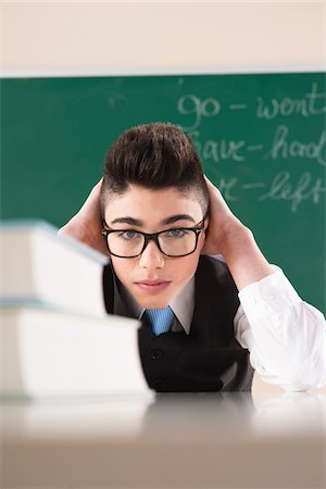 portrait chalkboard - Portrait of Boy in front of Chalkboard in Classroom Photographie de stock - Premium Libres de Droits, Code: 600-06543539