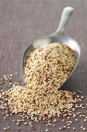 Close-up of Scoop overflowing with Quinoa Stock Photo - Premium Royalty-Free, Code: 600-06553479