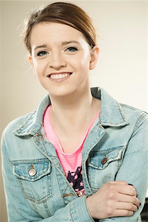 smiling teenage girl - Head and Shoulders Portrait of Teenage Girl in Studio Stock Photo - Premium Royalty-Free, Code: 600-06570934