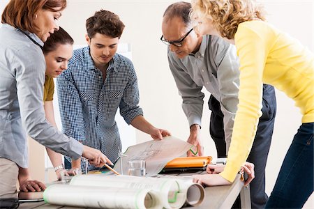 people looking at blueprints - Business People in Meeting Looking at Plans and Model of Windmill Stock Photo - Premium Royalty-Free, Code: 600-06621014