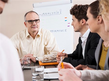 simsearch:600-06645495,k - Group of Business People having Meeting in Boardroom Fotografie stock - Premium Royalty-Free, Codice: 600-06645497