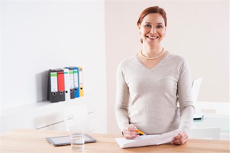 redhead woman 40s smiling - Mature Woman Working in Office Stock Photo - Premium Royalty-Free, Code: 600-06645520