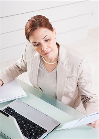 paper work - Mature Businesswoman Working in Office Stock Photo - Premium Royalty-Free, Code: 600-06645535